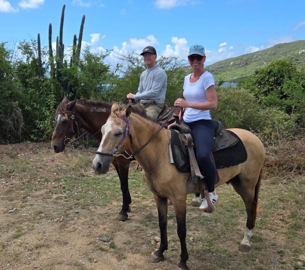 Guests riding horses on St. John